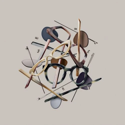 Still life of floating assorted eyeglasses, sunglasses, and eyeglass parts on a gray background in a studio, eyeglasses concept.