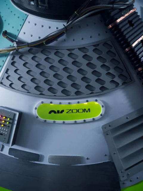 Detailed shot of a futuristic, industrial-style panel with metallic textures, ventilation, glowing accents, and visible wiring elements.