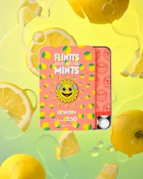Pink and orange mint tin surrounded by floating lemon slices and water droplets on a yellow background