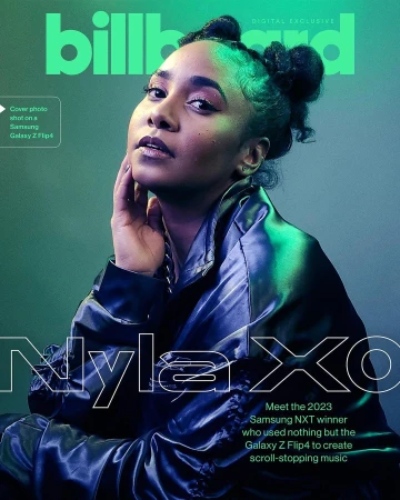 Billboard cover featuring NylaXO, a young Black woman with space buns, wearing an iridescent jacket with green and blue lighting.