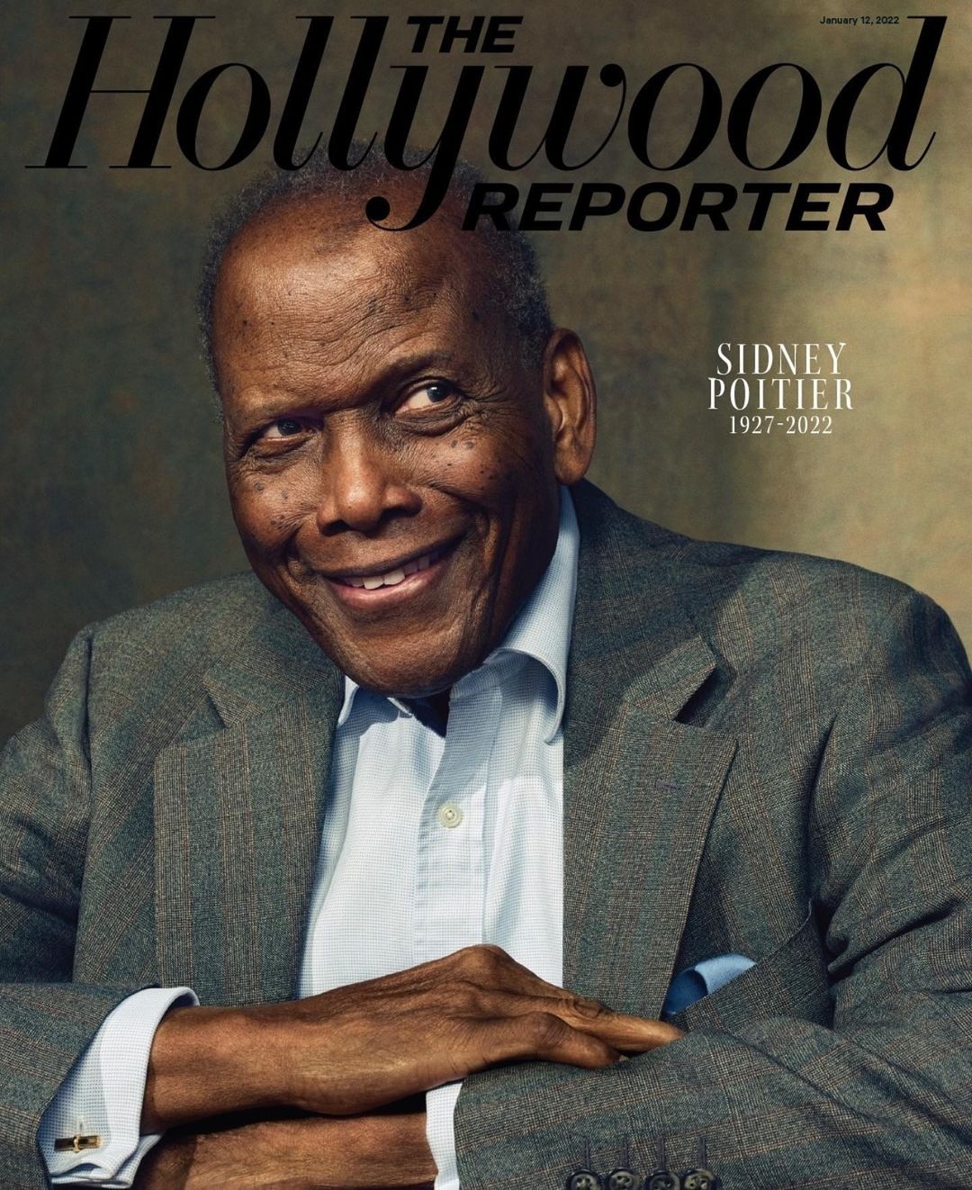 Portrait of Sidney Poitier on The Hollywood Reporter cover. He wears a gray suit and a white shirt, smiling against a dark background.