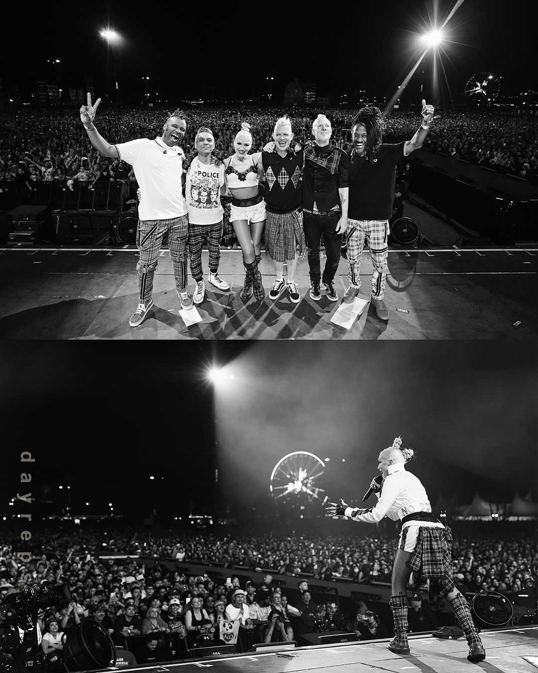 Black and white photo of a band posing on stage with arms raised, featuring a large crowd and stage lighting.