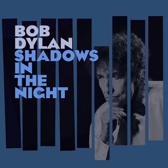Bob Dylan album cover, 'Shadows in the Night,' features portrait and geometric design with a blue color scheme, reflecting a classic, vintage aesthetic.