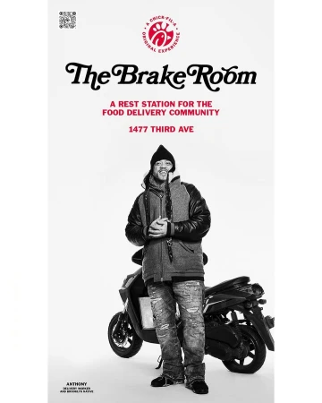 Black and white portrait of an adult man standing next to a motor scooter. The Brake Room food delivery community advertisement.