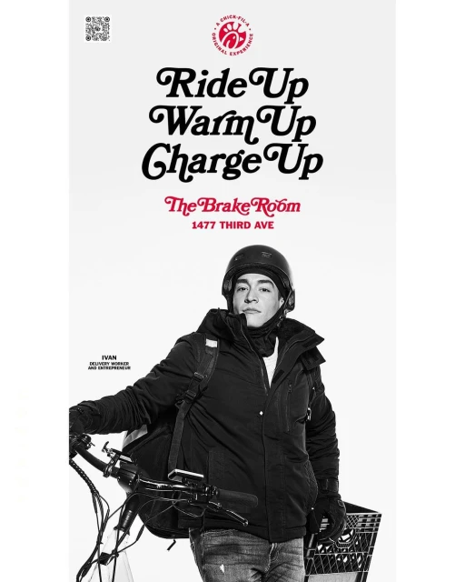 Delivery worker in helmet and winter coat poses with e-bike against a white backdrop with promotional text for The Brake Room.