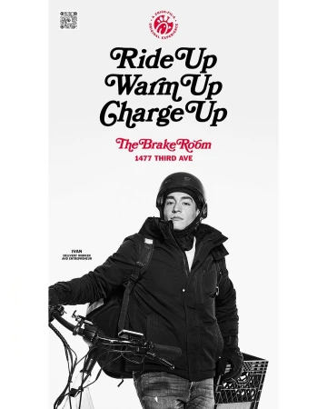 Delivery worker in helmet and winter coat poses with e-bike against a white backdrop with promotional text for The Brake Room.