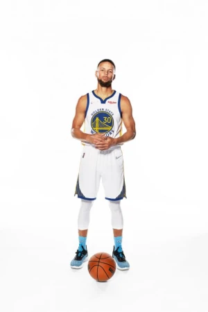 Full shot of an adult male basketball player in uniform with a basketball on a white background, wearing a blue and gold jersey.