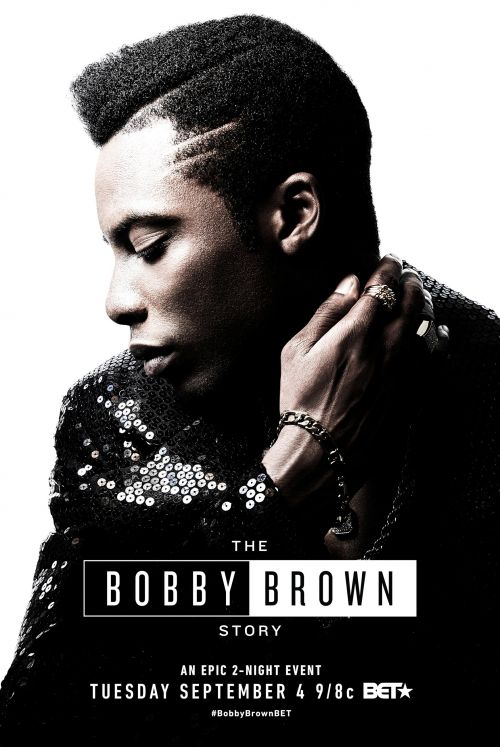 Profile of adult male on promotional poster for The Bobby Brown Story on BET; wearing sequined jacket, rings, bracelet. White backdrop. 