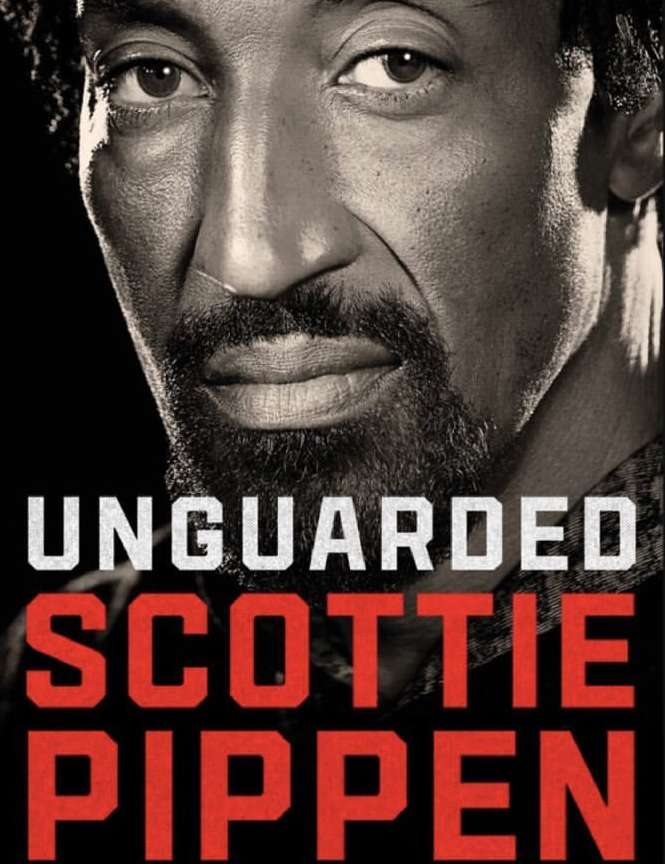 Close-up portrait of Scottie Pippen on the cover of his autobiography, 'Unguarded', featuring a sepia-toned image and bold red and white text.