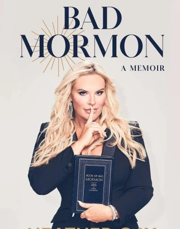 Book cover featuring a blonde woman in a black blazer, holding her memoir, titled 'Bad Mormon', against a neutral backdrop.