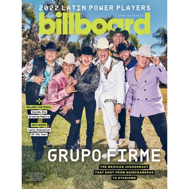 Billboard magazine cover featuring Grupo Firme. The group of seven is dressed in Western wear and hats, posed outdoors with Billboard logo.