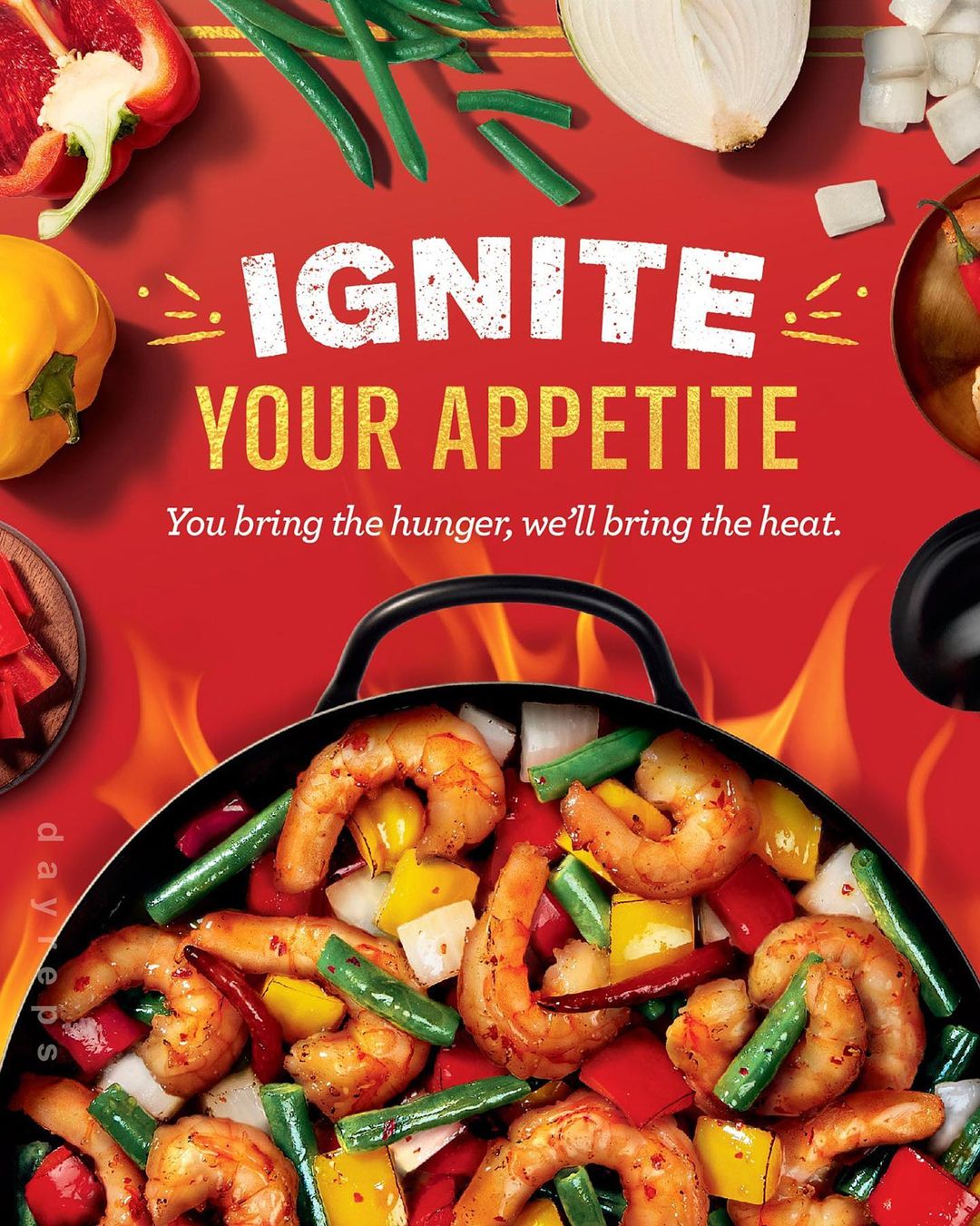 Close-up overhead shot of sizzling shrimp and mixed vegetables in a wok over a red background, with text promoting appetite.