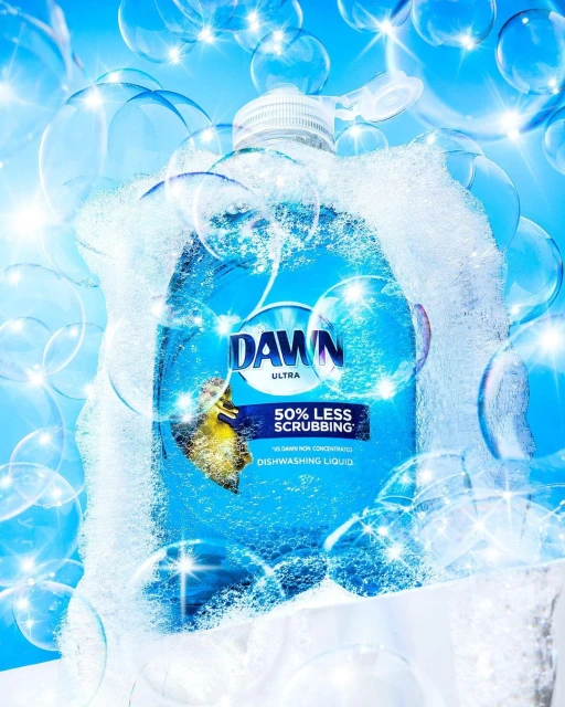 Blue Dawn dish soap bottle surrounded by clear bubbles, product shot on white with studio lighting and bright, clean presentation.