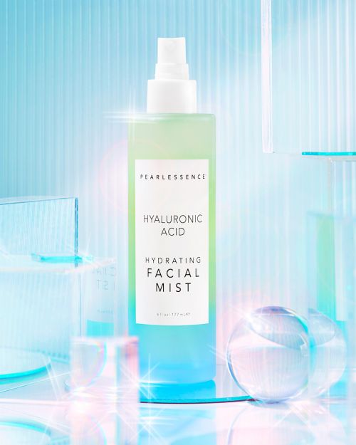 Pearlessence Hyaluronic Acid Hydrating Facial Mist bottle, presented against a background of transparent geometric shapes and blue hues.