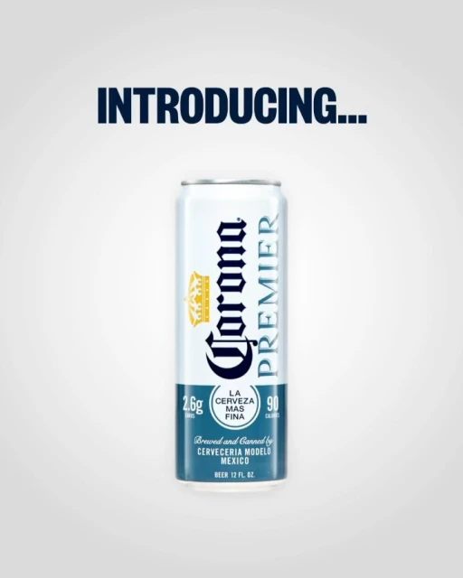 Corona Premier beer can stands centered on a white background, advertising alcoholic beverages and Corona branding.