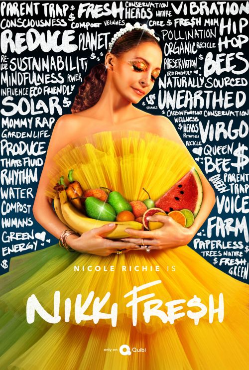 Nicole Richie in a conceptual portrait wearing a yellow tulle dress and holding fruits and vegetables against a chalkboard background.