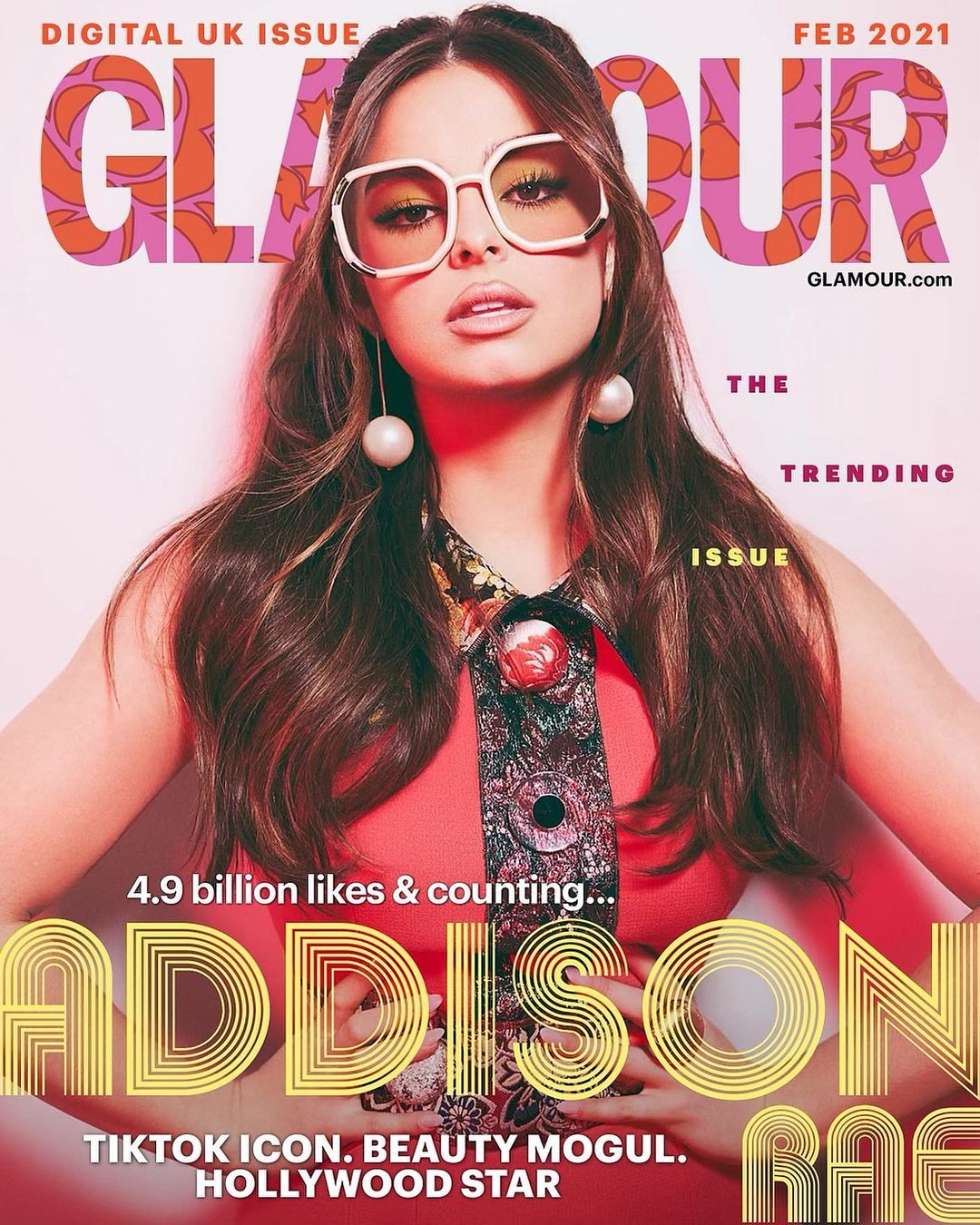 Glamour UK cover featuring Addison Rae, February 2021 issue. The cover features pink floral designs and light-pink background.