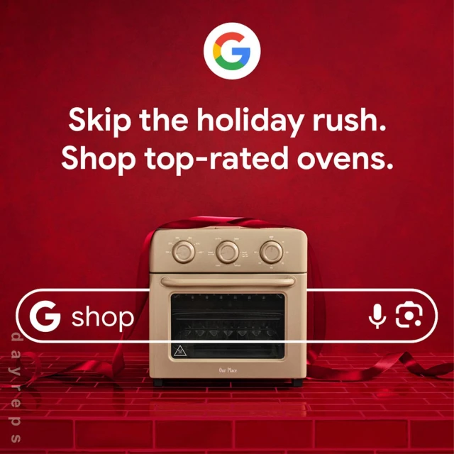 Beige-colored countertop oven displayed on a red brick surface, wrapped with a red ribbon, Google and ‘G Shop’ logos are visible.