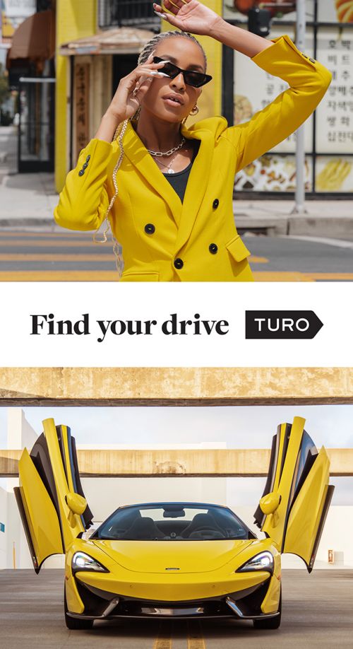 Stylish woman in a yellow suit poses in front of a building and a bright yellow sportscar with open doors is displayed beneath.