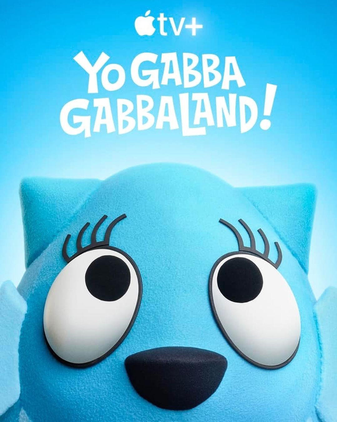 Yo Gabba Gabbaland! TV+ advertisement featuring a close-up of a smiling blue cartoon character with large eyes and eyelashes.