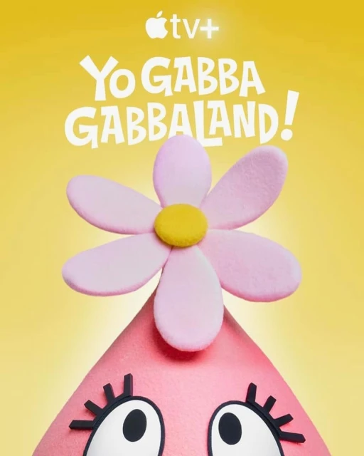 Close-up of Yo Gabba Gabbaland! poster featuring pink, cone-shaped character with flower-shaped hat, set against a yellow backdrop.