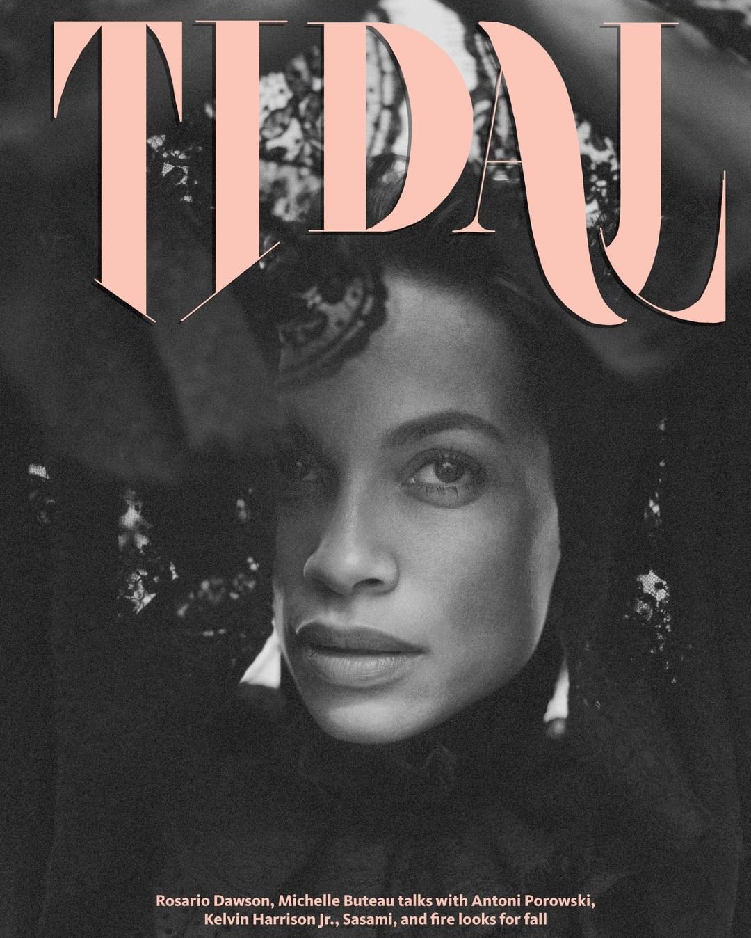 Rosario Dawson featured on magazine cover with large pink serif font spelling 'Tidal'. Dawson is wearing black lace top and has smokey eyeshadow.