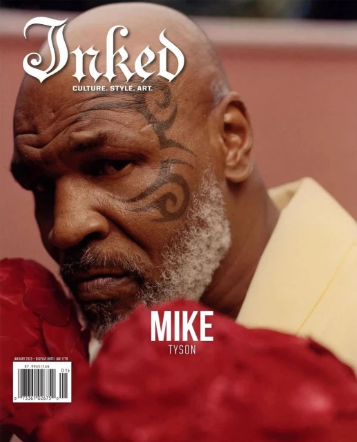 Mike Tyson on the cover of Inked magazine, featuring his facial tattoo, boxing gloves, and the magazine's logo.