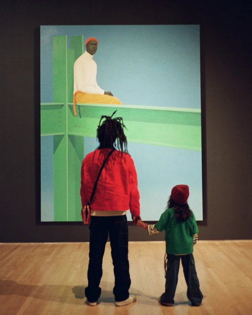 A mother and child are looking at a painting of a man on a green beam in an art museum. Red and green clothing, gallery lighting.