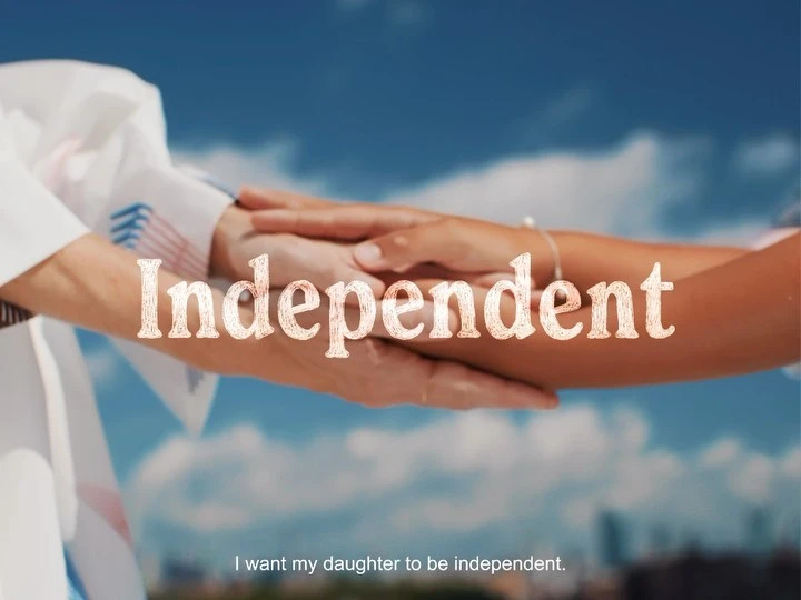 Close-up of two people holding hands against a cloudy sky. The word 'Independent' is superimposed on the image in light brown text.