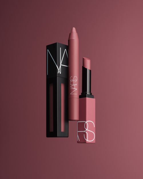 Nars lipstick, lip crayon, and liquid lip colour are displayed against a monochrome background, product photography for the beauty industry.