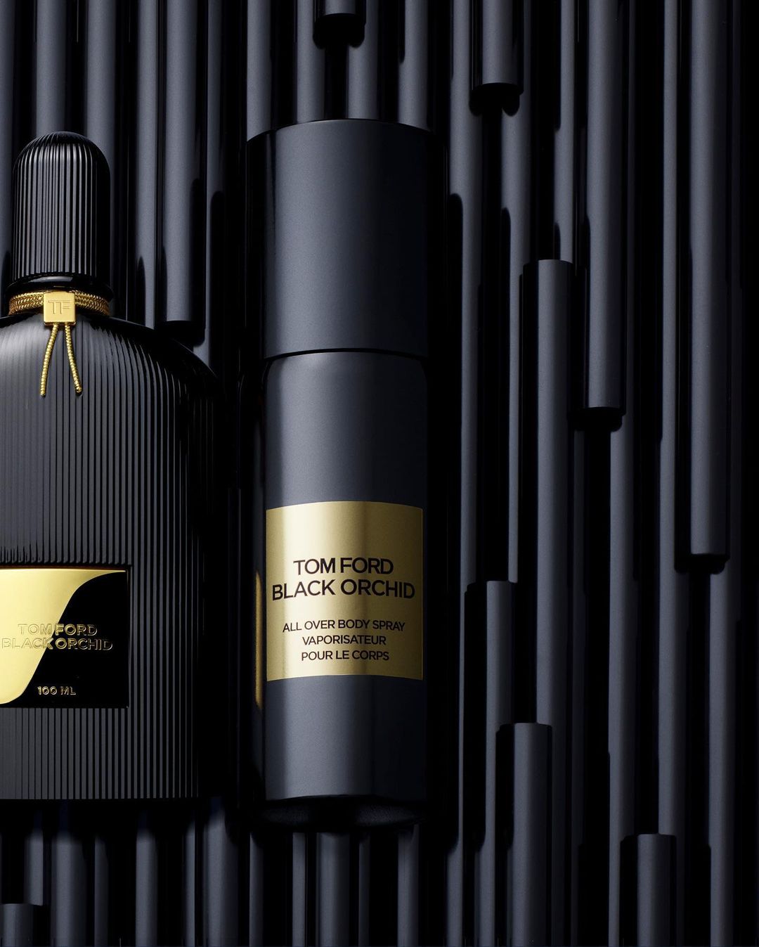 Black Tom Ford perfume and body spray on a black background, product shot for beauty, health, and fashion industries.