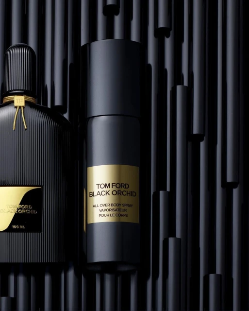 Black Tom Ford perfume and body spray on a black background, product shot for beauty, health, and fashion industries.