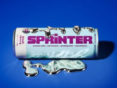 Sprinter black cherry vodka soda can with melting silver liquid on a blue surface, studio shot, product photography, beverage.