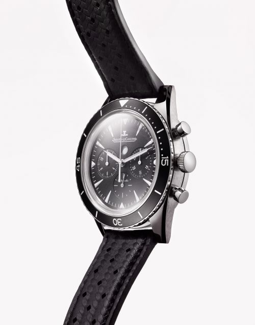 Close-up studio shot of a black chronograph wristwatch on a white background, featuring a perforated leather strap and metallic casing.