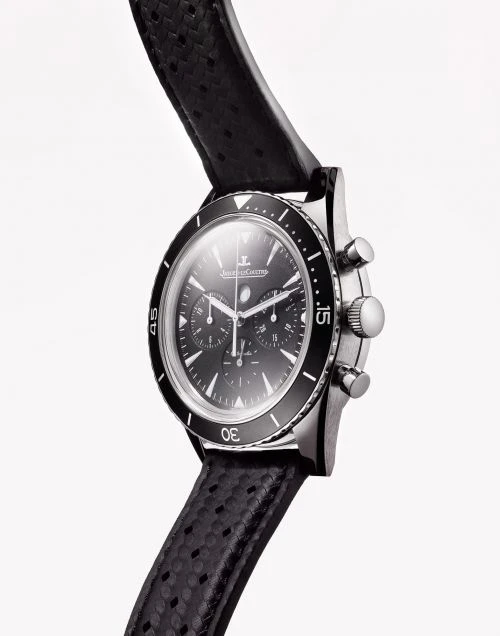 Close-up studio shot of a black chronograph wristwatch on a white background, featuring a perforated leather strap and metallic casing.