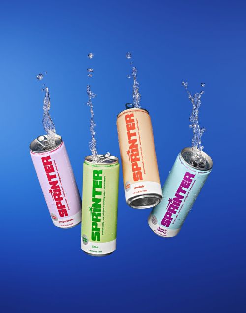 Four cans of Sprinter sparkling water in peach, lime, grapefruit, and blackberry flavors, with water droplets against a blue background.