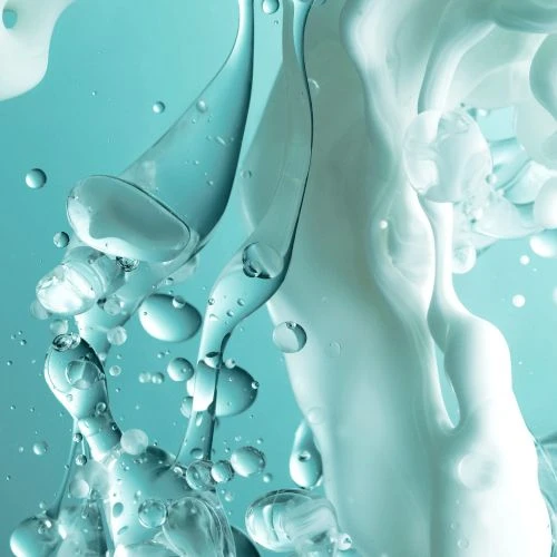 Abstract image featuring clear and white liquid shapes on a blue background, ideal for use as a backdrop or in beauty industry visuals.