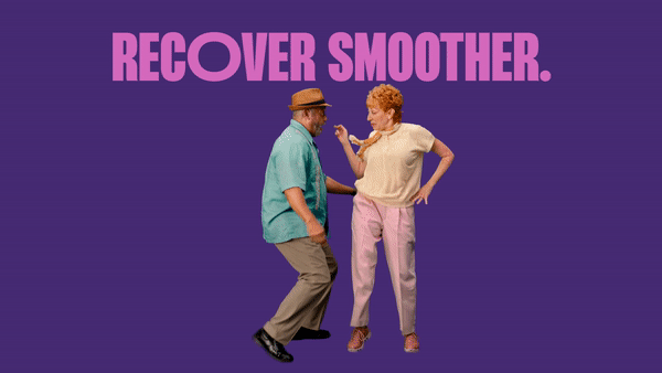 Elderly couple dancing in front of a purple background with the text “RECOVER SMOOTHER.” above them. The woman is holding a spoon.