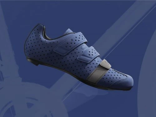 Studio shot of a blue perforated cycling shoe with velcro straps and a gray stripe, set against a stylized blue gradient background.