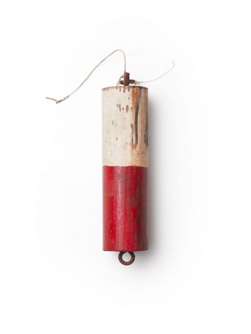 Red and white wooden buoy with aged paint, rope, and metal ring on a white background, providing a simple, nautical aesthetic.