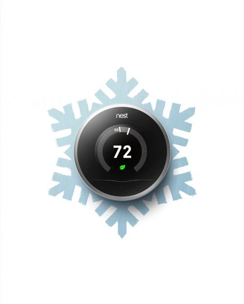 Smart thermostat on white background with blue snowflake design, showcasing a modern home technology product.