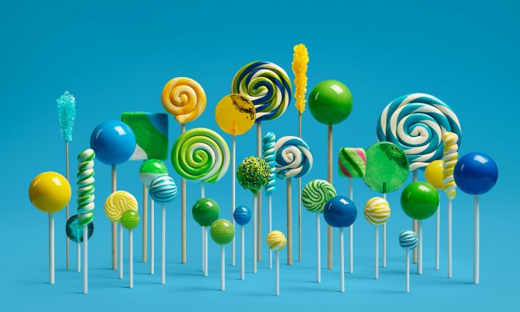 Vibrant assortment of lollipops and candy sticks in varying sizes and colors arranged against a solid light blue background.