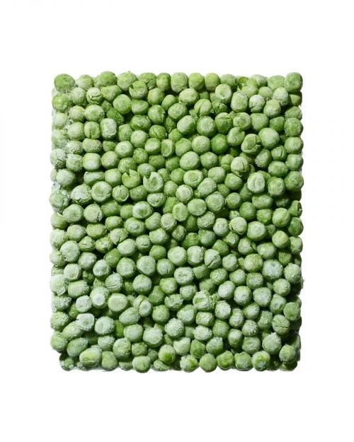 Close-up studio shot of vibrant green peas, densely packed in a square format, with a clean white background highlighting their texture.