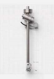Overhead studio shot of a metallic silver turntable tonearm resting on a white grid paper background.