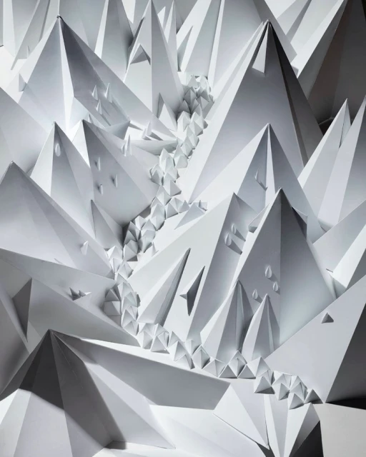 Paper art design featuring abstract geometric mountain peaks and river, creating a monochromatic landscape with shadows and depth.