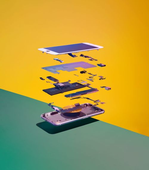 Exploded view of a smartphone's internal components against a color-block yellow and green background, showcasing deconstructed technology.
