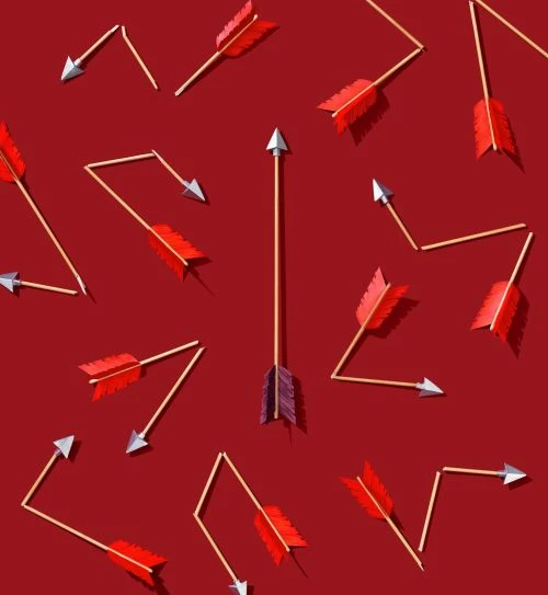 Conceptual image of multiple arrows on a red background, with one arrow aligned vertically and the others pointing in different directions.