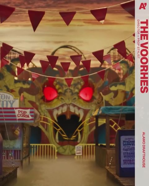 Spooky carnival entrance with monster face, red pennant flags, and fog at Alamo Drafthouse; The Voorhes Director + Prop Stylist.