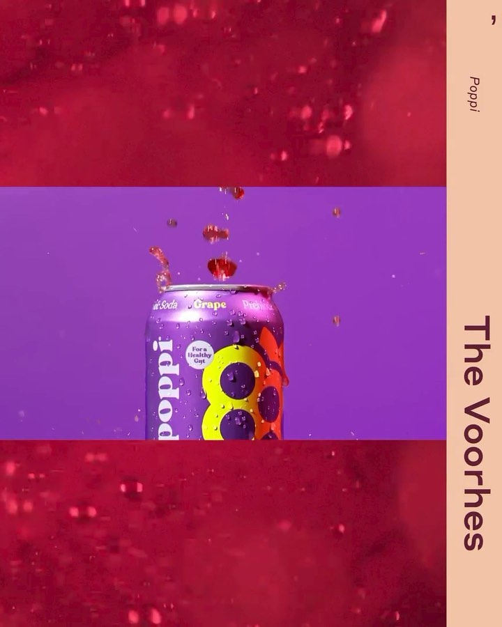 A purple can of Poppi soda with a splash of liquid against a purple background, split by a horizontal abstract burgundy pattern.