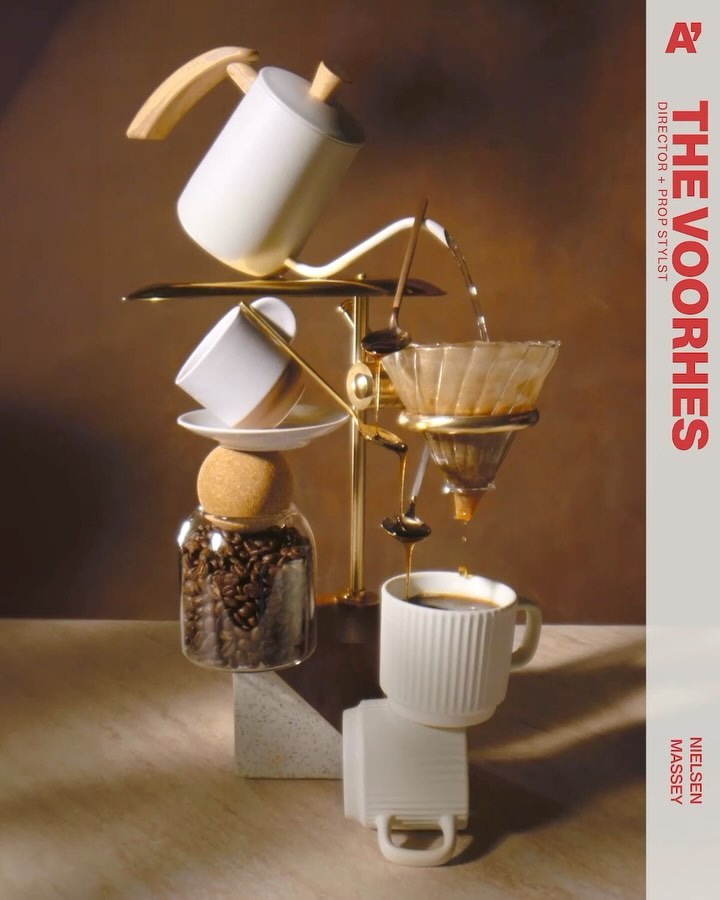 Still life of cascading coffee pot and cups, creating a visually striking and balanced composition with warm lighting and textures.